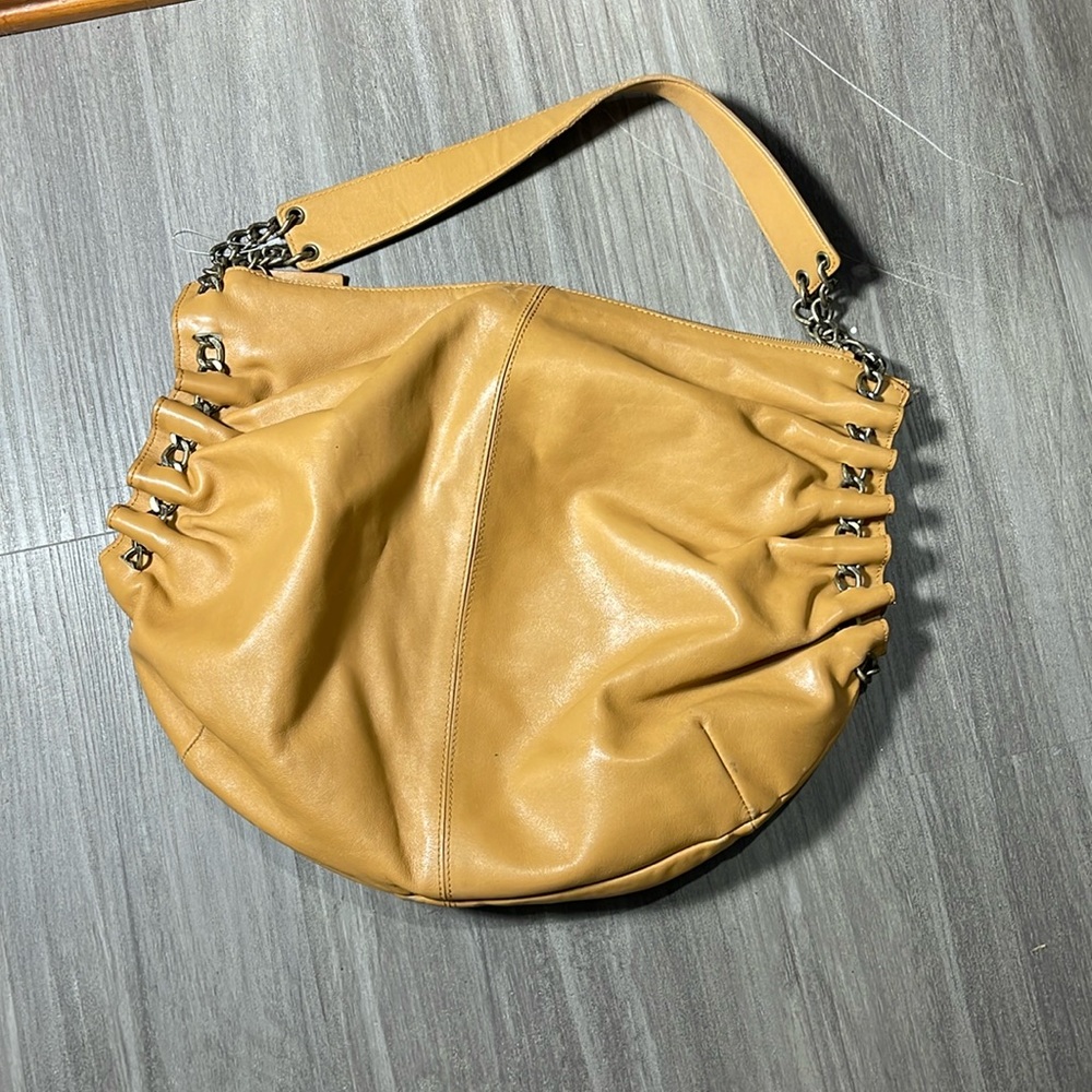 Sondra Roberts tan leather hobo with chains on the side. Great condition